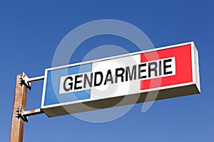 Sign of the french gendarmerie on a pole photo