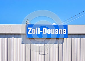 Sign with the German word Zoll means customs duty and the French word Douane means customs