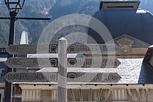 Sign giving direction to diferents cities  in the Abandoned railway station of Canfranc Huesca Spain