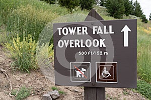 Sign giving directions to hikers to the Tower Fall Overlook, a famous waterfall in Yellowstone National Park Wyoming USA