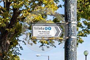 A sign giving directions to a member of community toilet scheme in teddington, london, England photo