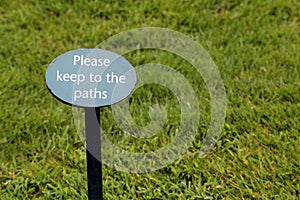 Sign in a grass lawn saying 