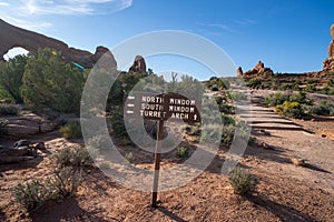 Sign guiding hikers to various arches in the windows section of Arches National Park