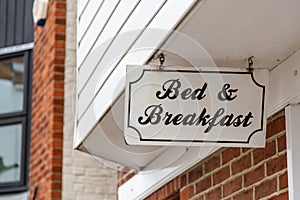 A sign hanging outside an english bed and breakfast