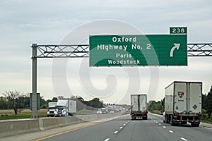 Sign On Highway 401 For Paris And Woodstock Exit