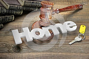Sign Home, Key, Judges Gavel And Book On Wood Table
