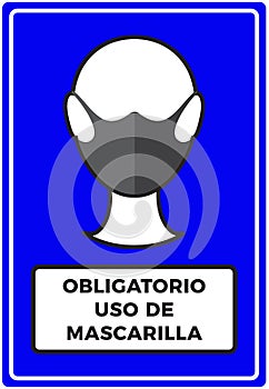 Sign of a human icon wearing protective face mask and spanish text Mandatory use of Face Mask