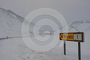Sign in the Icelandic highlands telling that there are 63 kilometers to the nearest town Myvatn