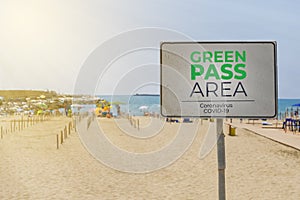 Sign indicates access to an italian beach allowed only to green pass holders