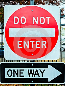Sign indicating access restricted, no entry, one way road ahead, do not enter