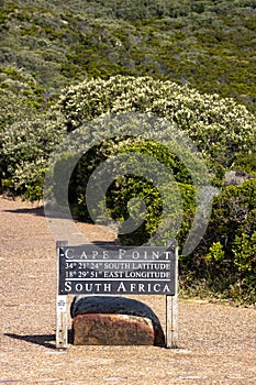 Sign indicating Cape Point with longitude e latitude near Cape Town, South africa