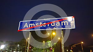 Sign indicating the end of the city of Amsterdam. Night city