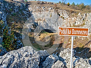 A sign indicating God`s Bridge Podul lui Dumnezeu, a natural bridge created by the colapse of a cave