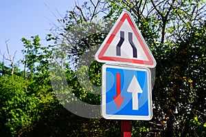 Sign indicating a narrowing of the road in france European traffic regulations