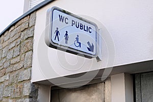 Sign indicating public toilets for men, women and disabled people