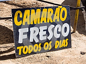 Sign indicating shrimp and seafood portugues photo