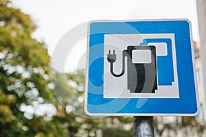 A sign indicating a special place for charging electric vehicles. A modern and eco-friendly mode of transport.