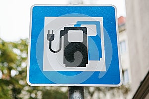 A sign indicating a special place for charging electric vehicles. A modern and eco-friendly mode of transport.