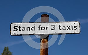 Sign indicating a taxi stand for three taxis in Widnes town centre April 2019