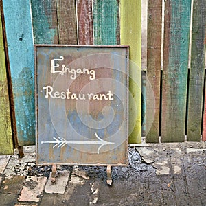 Sign with the inscription Eingang Restaurant in the center of Berlin