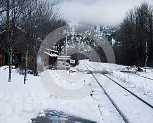 Sign with an inscription "Pemberton 95" near the train rails in winter