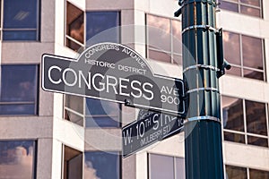 Sign at the intersection of West 8th Street and Congress Avenue