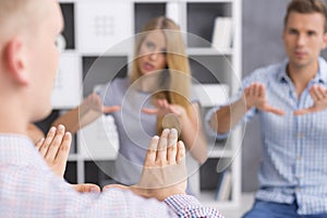 Sign language learners repeating new sign after their teacher