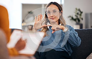 Sign language, speech therapy and woman talking to therapist in a consultation or counseling conversation. Communication