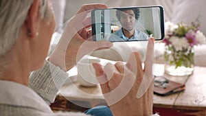 Sign language, video call and phone communication of a senior woman hand signing to a man at home. Waving, greeting and