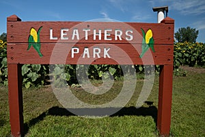 Sign for Leathers Park, in suburban Minneapolis, a park with sunflowers and corn