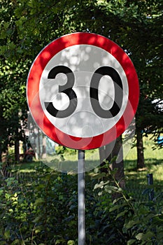 sign limiting the speed to thirty kilometers per hour