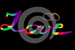 Sign `Love` with two golden rings above