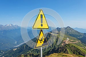 Sign man falling from a height, danger of falling from a cliff, mountain collapses, warning of an abyss