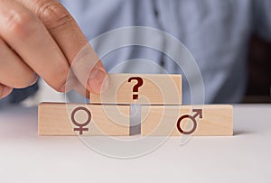 Sign of a man and a woman with a question . The concept of gender indeterminacy.