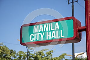 Sign of Manila City Hall on the street with blue sky