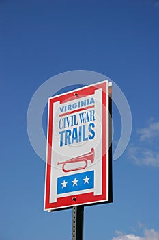 A sign marking historic civil war areas in Powhatan, Virginia against a  blue sky