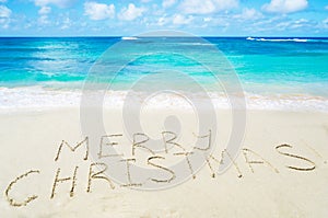 Sign Marry Christmas! on the sandy beach