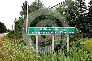 Sign for McKinnons Harbour with Gaelic and English name photo
