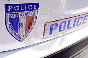 Sign of Municipal French police municipale on white car