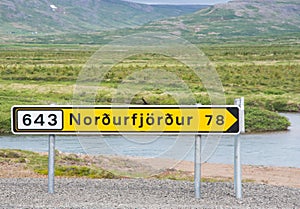 Sign near the road pointing towards village of Nordurfjordur in Icleand