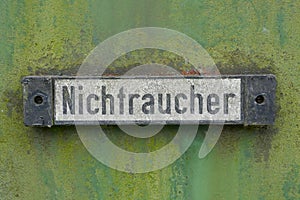 Sign `Nichtraucher` on the wall of an old German railroad car