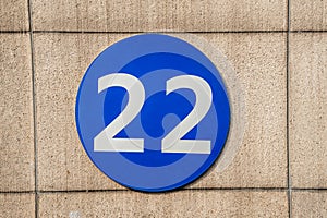 Sign with the number 22 hanging on the wall