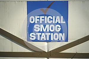 A sign for an official smog station in Los Angeles