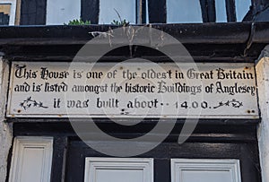 Sign at the oldest house in Anglesey Wales.