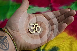 Sign OM from Hindu and Budhist religion on palm