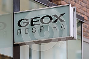 Sign outside a Geox Respira store on a high street in central London