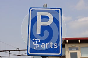 Sign that parking place is reserved for a doctor and other cars are not allowed