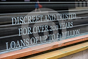 Sign in Pawnbrokers shop window on Fleet Street