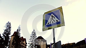 Sign of the pedestrian crossing on background sky