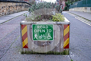 A sign on a pedestrianised bridge shows that it's open to walkers, cyclists and wheelchair users photo
